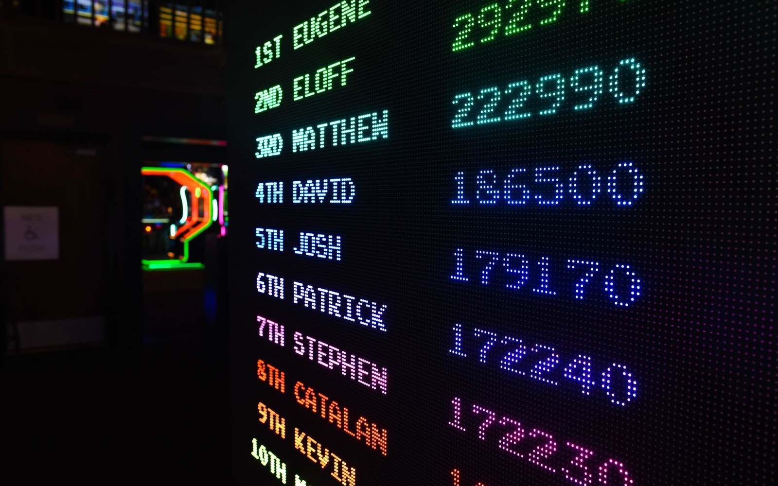 The Crucible scoreboard showing frame scores mid-match, out of focus crowd behind